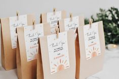 small brown bags with tags attached to them that say thank you for coming out of america