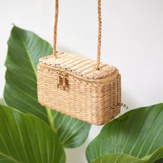 This charming crossbody straw bag is handcrafted from organic water grass hyacinth, and designed to add a playful touch to your day or your loved one. Each of these adorable woven bags is meticulously crafted in small batches in Chiang Mai, Thailand. Lightweight and easy to carry, this aesthetically woven crossbody bag is ideal for accompanying you wherever your day takes you. Made from 100% organic materials and featuring an elegant design, it shines timeless elegance. Whether for your use or a Summer Straw Bag With Braided Handles Crossbody, Summer Straw Crossbody Bag With Braided Handles, Summer Woven Straw Crossbody Bag, Vacation Straw Crossbody Bag With Braided Handles, Vacation Crossbody Straw Bag With Braided Handles, Braided Straw Crossbody Bag For Daily Use, Braided Crossbody Straw Bag For Daily Use, Vacation Braided Handles Crossbody Straw Bag, Daily Use Braided Crossbody Straw Bag