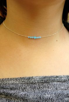 "This Tiny & Dainty Choker necklace is composed of a 3mm & 4mm Blue Opal beads on a delicate Sterling silver beaded chain. Great for layering with other delicate necklace or minimalist wear. 100% Sterling Silver . Length: - All Pieces will have a 1\" extension chain for best adjustment. - In order to select the size/length, it's best to measure your neck: Use a flexible ribbon, wrap it around your neck exactly where you want your choker to sit, and compare the length on a measuring tape. Cheap Handmade Choker With Round Beads, Minimalist Round Beads Choker For Festival, Minimalist Festival Choker With Round Beads, Silver Beaded Choker As A Gift, Minimalist Blue Choker With Round Beads, Minimalist Blue Round Beads Choker, Dainty Adjustable Choker With Spacer Beads, Minimalist Single Strand Round Beads Choker, Dainty Choker With Round Beads For Festivals