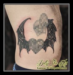 a man's stomach with two bats on it and the moon in the middle