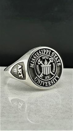 "Made to order - 925 sterling silver signet ring engraved with your college logo, your family crest or any other image that you request. No extra cost for side engravings. ✔Ring Details Metal: 925 Sterling SILVER Face Sizes (diameter): Small (10 mm), Medium (13 mm), Large (16 mm), X Large (19mm) After placing your order please send us a HIGH QUALITY digital image you would like me to use. Even if I have already been in contact with you PLEASE attach in the \"notes\" section your Size, Color and 1990 Class Ring, 1976 Class Ring, High School Rings, Class Rings College, Class Rings High School, School Rings, College Class, Class Rings, College Logo