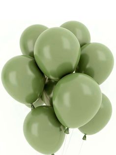 a bunch of green balloons floating in the air on a white background with clippings