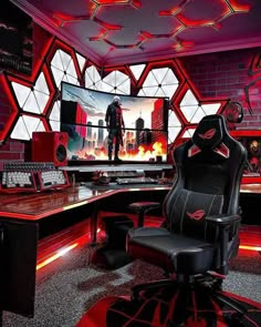 a gaming room with red lighting and black chair in front of the computer monitor on the wall