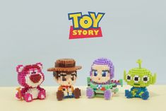 the toy story characters are made out of legos and have been placed in front of each other