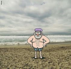 a man standing on top of a sandy beach next to the ocean under cloudy skies