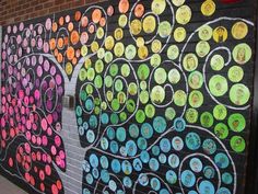 a wall with many circles painted on it