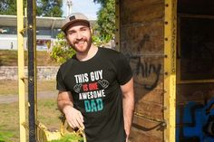 a man standing in front of a building with grass growing out of it's hole