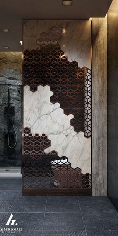 a bathroom with marble walls and flooring in the shape of hexagons