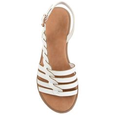 The Solay sandal by Journee Collection is such a unique piece to add to your closet. This fun sandal features a braided diagonal strap detail with a multi strap toe design. This sandal is unique where it has a buckle detail but this is a slip-on shoe. You can easily slide your foot in and have the back to hold you in place. The cushioned insole finishes off the design. At Journee Collection our sandal styles are going to be perfect for any occasion. Whether that be a formal business or casual dr Strappy Wedge Sandals With Buckle For Beach, Strappy Wedge Sandals With Buckle Closure For Beach, Synthetic Sandals With Braided Ankle Straps, Strappy Wedge Sandals With Adjustable Strap For Beach, Strappy Sandals With Heel Strap For The Beach, Beach Strappy Slingback Sandals With Heel Strap, White Sandals With Braided Straps, Casual Sandals With Braided Straps And Open Heel, Strappy Sandals With Heel Strap For Vacation