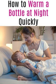 a woman holding a baby in her lap and texting how to warm a bottle at night quickly