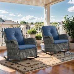 two wicker rocking chairs sitting on top of a wooden floor