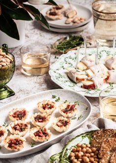 a table topped with plates filled with food