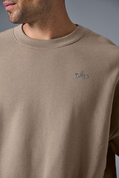 Cozy and comfortable with plenty of street cred, too, thanks to a chrome Alo logo on the chest and an on-trend offering of colors. It has a classic crewneck, ribbing at the cuffs and hem and a laid-back, dropped-shoulder fit. It’s made from drapey, midweight French terry that’s smooth on the outside and fleecy on the inside. Finish off your studio-to-street look with the matching Accolade sweatpants. Oversized Alo Yoga Tops For Fall, Alo Yoga Relaxed Fit Tops For Fall, Alo Yoga Relaxed Fit Crew Neck Sweatshirt, Alo Yoga Cotton Sweatshirt For Fall, Sporty Alo Yoga Crew Neck Sweatshirt, Alo Yoga Winter Crew Neck Sweatshirt, Alo Yoga Casual Fall Sweatshirt, Alo Yoga Winter Crew Neck Top, Alo Yoga Long Sleeve Tops With Ribbed Cuffs