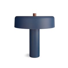 a blue table lamp on a white background