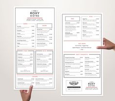 two hands holding up some menus on top of each other in front of a white background