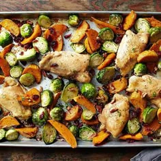 a pan filled with chicken, brussel sprouts and sweet potatoes