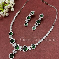 BEAUTIFUL AMERICAN DIAMOND NECKLACE SET *  Main Color : Green * Skin Friendly : This Product does not contain harmful constituents. Anti-allergic safe for Skin. * Quality : Made from Premium Quality Material. This Product assures to remain in its Original Glory even after several usages.     . Actual Images of item are shown above, Please be aware of the actual colors may vary from the color shown on your screen, as monitor    settings may vary from individual to individual. . Welcome to Our Ets Elegant Green Rhinestone Necklace For Wedding, Green Crystal Rhinestone Necklace For Wedding, Ad Necklace Set, Diamond Pendent, Indian Fashion Jewellery, American Diamond Necklaces, Green Skin, Bridal Jewelry Set, Diamond Necklace Set