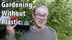 a man in glasses holding up a plastic object with the words gardening without plastic on it