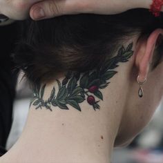 a woman with a tattoo on her neck