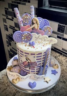 a birthday cake decorated with an image of a woman on the top and stars around it