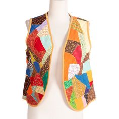 Quirky vest with various multicolored patches quilted to the outside and fully lined on inside. Bust is open down center.  Measurements Bust: 36" (open) Length: 21" Arm Opening: 20" Condition: Great handmade vintage condition Bohemian Multicolor Patchwork Vest, Retro Multicolor Cotton Vest, Multicolor Patchwork Sleeveless Vest, Retro Cotton Patchwork Vest, Multicolor Patchwork Vest For Spring, Multicolor Patchwork Vest, Patch Vest, Patch Quilt, Vest Outfits