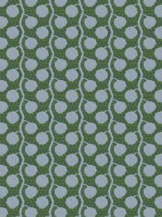 a green and blue fabric with white circles on the top, as well as dots in the middle