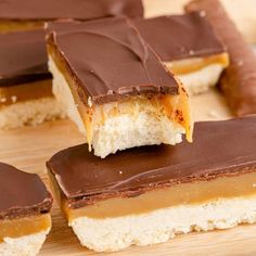 chocolate and peanut butter bars on a cutting board