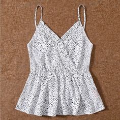 New, Never Worn, No Known Flaws. Very Versatile Top. Can Easily Be Dressed Up Or Down. Wear Layered, Underneath A Sweater Or Jacket, On Its Own Cinched Waist. Peplum Style. Adjustable Spaghetti Straps. Polka Dot V-neck Tops For Summer, White V-neck Camisole With Ruffles, White V-neck Ruffled Camisole, Sleeveless Polka Dot Tops For Vacation, Chic Polka Dot Tank Top For Spring, Fitted Polka Dot Casual Tank Top, Spring Chic Polka Dot Tank Top, Fitted Polka Dot Sleeveless Top, Ruffled V-neck Camisole For Vacation