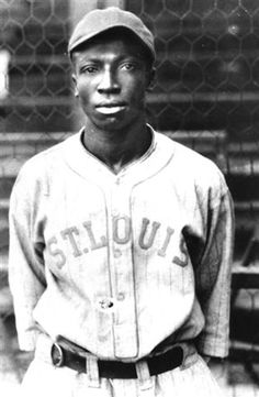 an old black and white photo of a baseball player