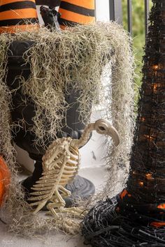 halloween decoration with fake skeletons and pumpkins