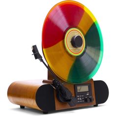 an old fashioned record player with a multicolored disc