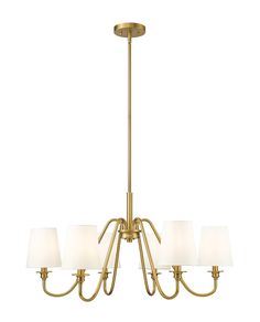 a brass chandelier with five white shades