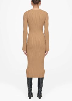 Designed by Anine Bing. A crewneck midi dress featuring long fitted sleeves that flare out slightly into a bell shape at each cuff. The Sia Dress is made from a luxurious ribbed-knit fabrication infused with a touch of comfort stretch in neutral camel. The Sia Dress is cut for a fitted shape that relaxes slightly from the hips through its midi-length hem. Take your true size. Return Policy Camel Fabric, Fitted Sleeves, Anine Bing, Wide Sleeves, Everyday Wardrobe, Global Fashion, Modern Woman, Wardrobe Essentials, Midi Length