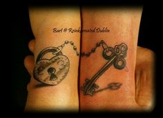 two people with tattoos on their arms holding keys and heart shaped key tattoo designs for wrist