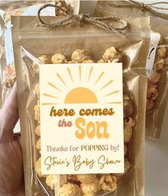 there is a bag of popcorn that says here comes the son thanks for popping out