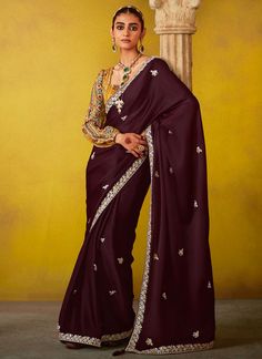 Capture the exuberance of womanhood in its full glory that will bring out your fragility and femininity. Get the simplicity and grace with this wine silk and tissue traditional saree. Muslim Wedding Dress, Indian Designer Sarees, Muslim Bride, Indian Sarees Online, Designer Sarees Online, Yellow Blouse, Indian Festivals, Traditional Sarees, Blouse Pattern