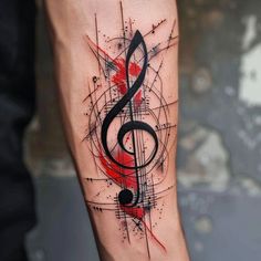 a tattoo with music notes on it's arm and an ink splattered design