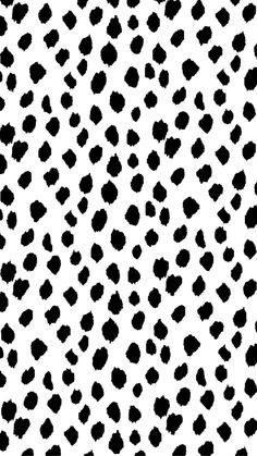 a black and white pattern with spots