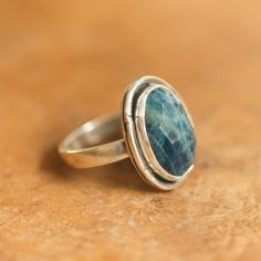 Our new Chunky Boho Ring in Apatite blends the weight and feel of a big chunky ring with a super comfortable shank and buttery polishing to become the most comfortable ring you'll want to wear every day! This is a Ready to Ship ring, Size 7.5, with a beautiful deep blue faceted apatite cabochon. Each piece is handmade to the irregular stones using a traditional "chisel notched" boho design. All traditional Silversmithing is done in my Baltimore, MD studio. Faceted AAA Apatite approx 10X16X6mm To Handmade Apatite Rings For Anniversary, Oval Apatite Gemstone Ring, Silversmith Rings, Apatite Ring, Turquoise Gold Ring, Purple Amethyst Ring, Purple Rings, Chunky Ring, Tourmaline Bracelet