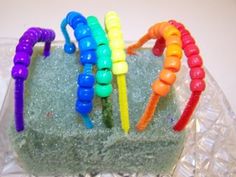 there is a cake that has been made to look like caterpillars on it