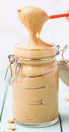 a jar filled with peanut butter sitting on top of a table