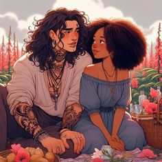 two people sitting next to each other in front of flowers