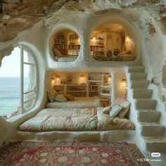 a bedroom in the shape of a cave with stairs leading up to it