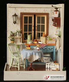 a doll house is set up with furniture and accessories for the dolls house's kitchen