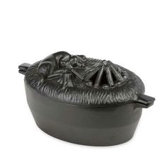 a black cast iron pot with a lid