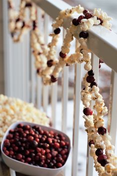 popcorn corn and cranberries are arranged on the railing