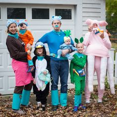 a group of people in costumes standing next to each other