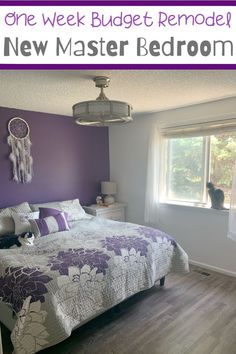 a bed room with a neatly made bed and a cat sitting on the window sill