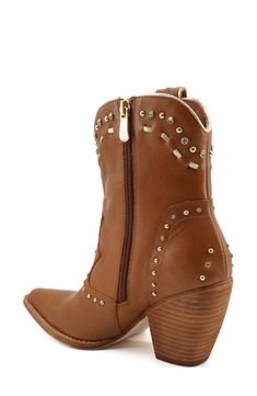 Polished studs and sparkling crystals put a contemporary spin on this stacked-heel Western boot. Leather upper/synthetic lining/leather sole Imported Fall Ankle Boots With Rhinestone Rivets, Studded Brown Ankle Boots, Studded Leather Ankle-high Heeled Boots, Studded Leather Ankle Boots, Studded Leather Boots With Snip Toe, Brown Studded Ankle Boots, Ankle-high Leather Boots With Spikes, Western Leather Boots With Studded Rubber Outsoles, Leather Boots With Silver Studs And Snip Toe