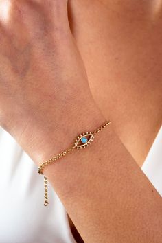 "This 14K gold evil eye bracelet is a stylish and delicate accessory that would make a great gift for any occasion. The bracelet features a rolo chain link design and is adorned with an evil eye charm, which is believed to protect against negative energy and bring good luck. The bracelet is dainty and would be a perfect choice for everyday wear. It would make a thoughtful gift for a friend or loved one, whether it be for a special occasion like Christmas, Father's Day, Mother's Day, Valentine's Gold Evil Eye Bracelet, Bracelet Evil Eye, Maid Of Honor Gift, Link Design, Bracelet Dainty, Dainty Bracelet, Maid Of Honour Gifts, Eye Lashes, Dainty Bracelets